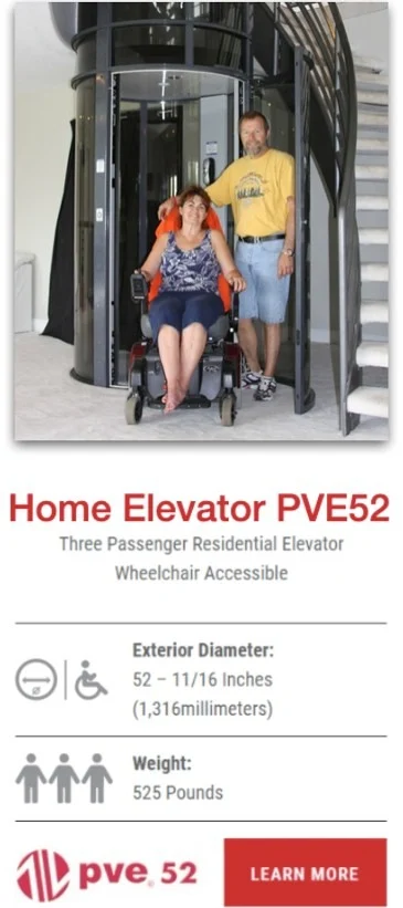 Woman in a wheelchair exiting the PVE52 home elevator with a man beside her near a staircase